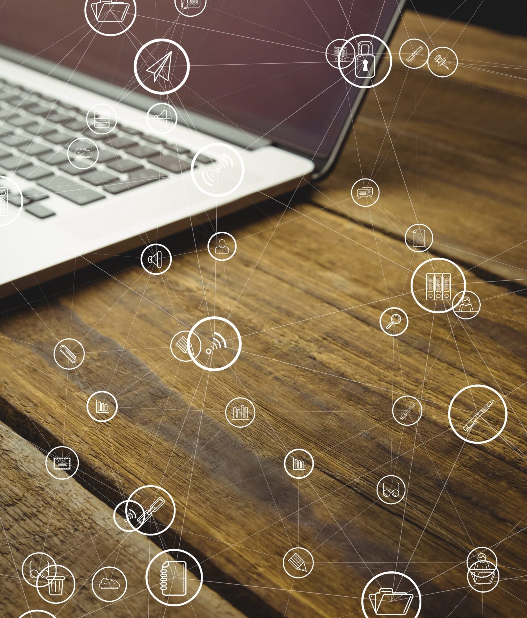 digital composite of laptop with communication graphics